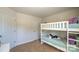 This bedroom features a white bunk bed, plush pillows, and neutral walls at 5137 Hyrule Dr, Charlotte, NC 28262