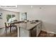 Open concept kitchen and dining area featuring granite counters and a seating area at 5137 Hyrule Dr, Charlotte, NC 28262