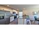 Modern kitchen with white cabinets, granite counters, stainless appliances, and a breakfast bar with seating at 5137 Hyrule Dr, Charlotte, NC 28262