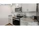 Charming kitchen featuring granite countertops, stainless steel appliances, and ample cabinet space at 5137 Hyrule Dr, Charlotte, NC 28262