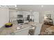 Open kitchen with stainless steel appliances, granite countertops, breakfast bar, and ample cabinet space at 5137 Hyrule Dr, Charlotte, NC 28262