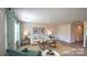 Cozy living room featuring modern furnishings, natural light, hardwood floors, and neutral wall color at 5137 Hyrule Dr, Charlotte, NC 28262