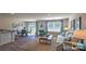 Bright living room with hardwood floors, neutral walls, dining area, and comfortable seating arrangement at 5137 Hyrule Dr, Charlotte, NC 28262