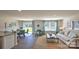 Open-concept living room featuring a dining area, stylish furniture, natural light, and cohesive decor at 5137 Hyrule Dr, Charlotte, NC 28262