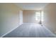 Spacious empty bedroom with neutral walls, carpet, a double window and a walk in closet at 5436 Scarlet Sage Dr, Charlotte, NC 28215