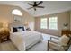 Inviting bedroom with vaulted ceiling, and abundant natural light from the large windows at 5436 Scarlet Sage Dr, Charlotte, NC 28215