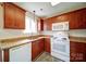 Functional kitchen with wooden cabinetry, granite countertops, and stainless steel appliances at 5436 Scarlet Sage Dr, Charlotte, NC 28215