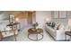 Cozy loft area featuring neutral decor, comfortable seating, and ample natural light at 5436 Scarlet Sage Dr, Charlotte, NC 28215