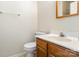 Bathroom with wood vanity and brushed nickel faucet, with shower visible in mirror at 6203 Rosecroft Dr, Charlotte, NC 28215