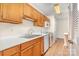 Well-equipped kitchen with wooden cabinets and bright countertops at 6203 Rosecroft Dr, Charlotte, NC 28215