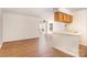 Bright living room with hardwood floors, white walls, and lots of natural light at 6203 Rosecroft Dr, Charlotte, NC 28215