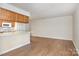 Inviting living room and kitchen area with hardwood floors at 6203 Rosecroft Dr, Charlotte, NC 28215