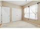 Cozy bedroom with neutral carpet, closet, and window with privacy curtain at 6303 Trevor Simpson Dr, Indian Trail, NC 28079