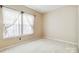 Cozy bedroom with natural light, neutral carpet and privacy window at 6303 Trevor Simpson Dr, Indian Trail, NC 28079