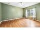 Spacious bedroom with a ceiling fan, beautiful natural light, and laminate flooring at 6303 Trevor Simpson Dr, Indian Trail, NC 28079