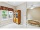 Bright breakfast nook with a charming hutch and beautiful views from the adjacent window at 6303 Trevor Simpson Dr, Indian Trail, NC 28079
