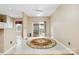 Bright dining space with tile floor, large window, and a ceiling fan at 6303 Trevor Simpson Dr, Indian Trail, NC 28079