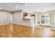 Open floor plan combines living and dining, bathed in light with modern ceiling fans at 6303 Trevor Simpson Dr, Indian Trail, NC 28079