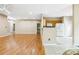 Open floor plan with hardwood floors and easy access to the kitchen and dining area at 6303 Trevor Simpson Dr, Indian Trail, NC 28079