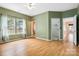 Spacious main bedroom with a ceiling fan, beautiful natural light, and laminate flooring at 6303 Trevor Simpson Dr, Indian Trail, NC 28079