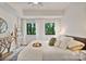 Comfortable bedroom with a ceiling fan, natural light, and cozy decor at 715 N Church St # 310, Charlotte, NC 28202