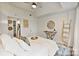Bright bedroom with a ceiling fan, stylish decor, and an ensuite bathroom at 715 N Church St # 310, Charlotte, NC 28202