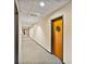 Long hallway with carpet, lighting, and unit door decorated with a wreath at 715 N Church St # 310, Charlotte, NC 28202