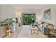 A cozy living room features a modern couch, stylish decor, and access to a balcony at 715 N Church St # 310, Charlotte, NC 28202