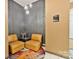 Inviting lobby with stylish chairs, a colorful rug and decorative wall features at 715 N Church St # 310, Charlotte, NC 28202