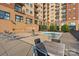 Inviting community pool with sun loungers and tables, perfect for relaxation at 715 N Church St # 310, Charlotte, NC 28202
