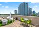 Inviting roof deck with comfortable seating and stunning city views at 715 N Church St # 310, Charlotte, NC 28202