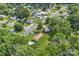 An aerial view shows a residential neighborhood with lush greenery, manicured lawns and mature trees at 798 Wilson St, China Grove, NC 28023