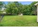 Spacious back yard featuring green lawn, storage shed, and fenced in area at 798 Wilson St, China Grove, NC 28023