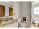 Bathroom needing renovation with outdated fixtures, including sink, toilet, and mirror at 798 Wilson St, China Grove, NC 28023