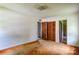 Bedroom featuring outdated carpet, a closet, and an ensuite bathroom ready for renovation at 798 Wilson St, China Grove, NC 28023