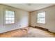 Bedroom with two windows and carpet, awaiting renovation and upgrades at 798 Wilson St, China Grove, NC 28023
