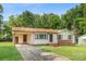 Single-story home featuring a convenient carport, light siding, and a front yard at 798 Wilson St, China Grove, NC 28023