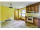 Retro kitchen featuring wooden cabinets, tile countertops, and colorful walls at 798 Wilson St, China Grove, NC 28023