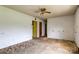Empty living room featuring carpeted floors, a ceiling fan, and bare walls at 798 Wilson St, China Grove, NC 28023
