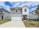 Charming two-story home featuring a front-facing garage, manicured lawn, and inviting entrance at 804 Blue Canyon Dr, York, SC 29745