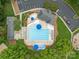 Aerial view of a community pool with ample seating and parking at 8906 Pickering Grove Ln, Charlotte, NC 28216