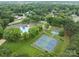 Wide aerial shot showcasing community pool, playground and tennis courts at 8906 Pickering Grove Ln, Charlotte, NC 28216