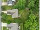 Aerial view of a private backyard featuring a well-maintained lawn and mature trees at 8906 Pickering Grove Ln, Charlotte, NC 28216