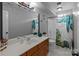 Bathroom featuring a large mirror, spacious vanity, and a shower with a decorative curtain at 8906 Pickering Grove Ln, Charlotte, NC 28216