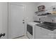 Well-lit laundry room featuring a modern washer and dryer set and ample shelving for storage at 8906 Pickering Grove Ln, Charlotte, NC 28216