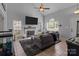 Inviting living room with a fireplace, large windows, comfortable seating, and tiled floors at 8906 Pickering Grove Ln, Charlotte, NC 28216