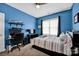 Blue bedroom showcasing a desk and shelves with decorative items at 104 Edgewater Park St, Davidson, NC 28036