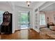 Inviting foyer with hardwood floors, an open doorway and a view to the outside at 104 Edgewater Park St, Davidson, NC 28036