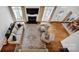 Bright living room featuring a fireplace, hardwood floors, and large windows bringing in lots of light at 104 Edgewater Park St, Davidson, NC 28036