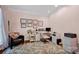 Cozy home office with floral rug, natural light, providing a comfortable workspace at 104 Edgewater Park St, Davidson, NC 28036